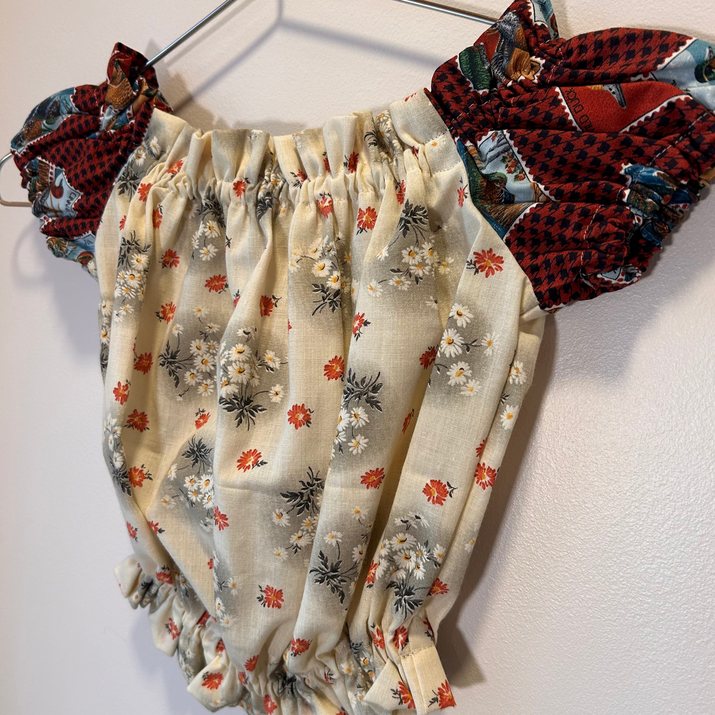 Duck sleeve & black floral top.